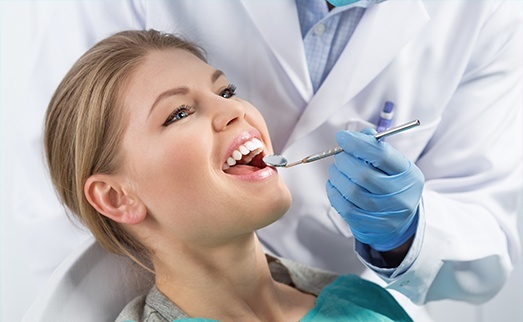 Woman receiving dental exam