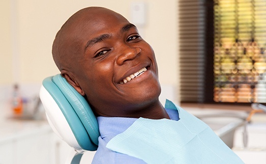 Smiling man in dental chair