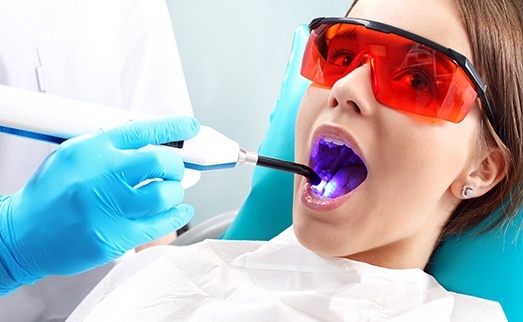 Patient receiving dental sealants