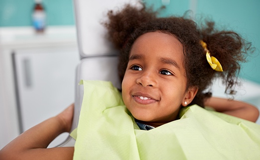 Smiling child in dental chair