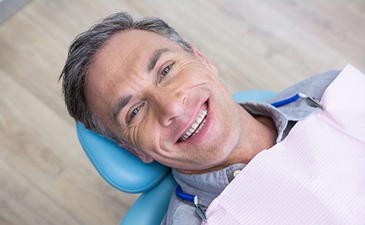 Smiling man in dental chair