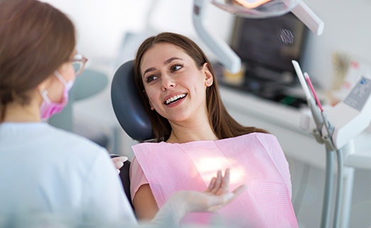 Woman in dental chair smiling