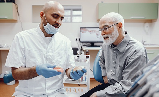 a man and his dentist discussing dentures