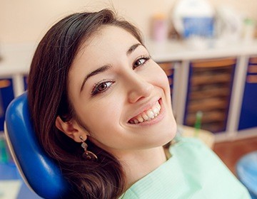 Smiling woman in dental chair