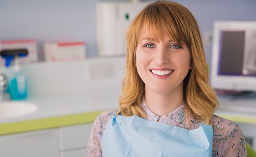 Woman in dental chair smiling