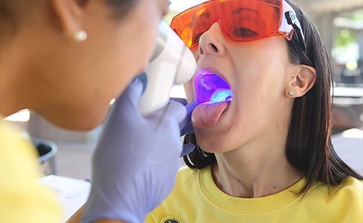 Patient receiving oral cancer screening