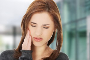 Close-up of woman with oral discomfort