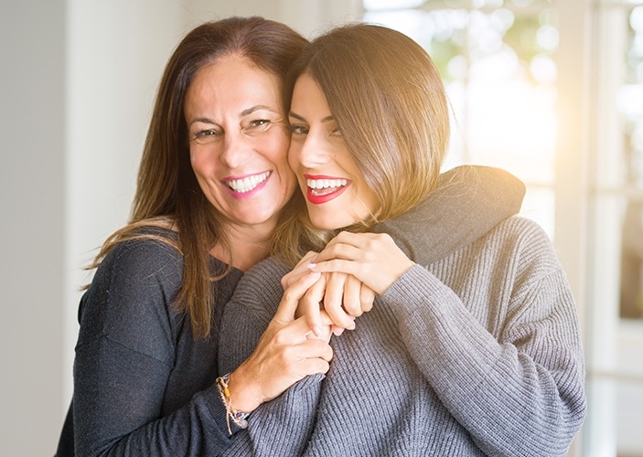 Smiling mother and daughter