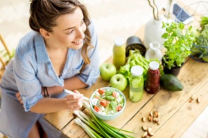 A woman eating a healthy, nutritious meal