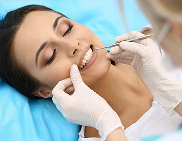 Woman receiving dental exam