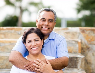 Smiling older man and woman outdoors